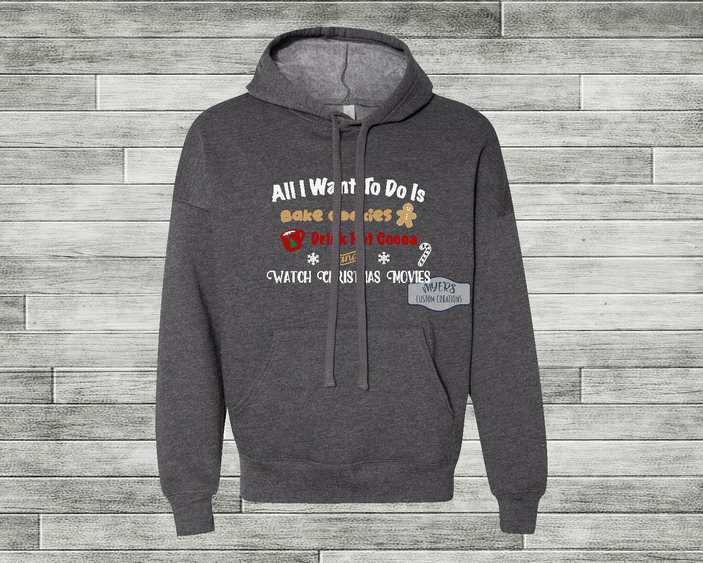 All I Want to Do Christmas Heather Dark Grey Bella+Canvas hoodie with white, tan, red, green, and chocolate HTV