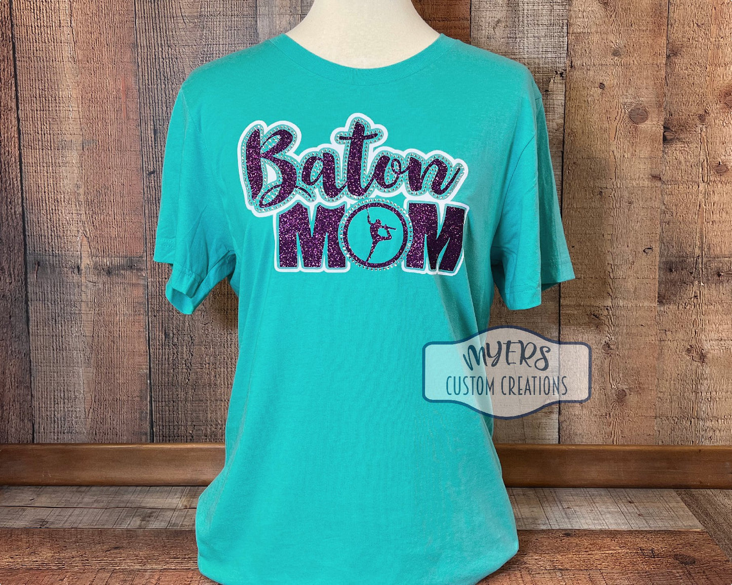 Baton Mom Medium t-shirt - Heather Sea Green - white & purple glitter HTV and crystal rhinestones