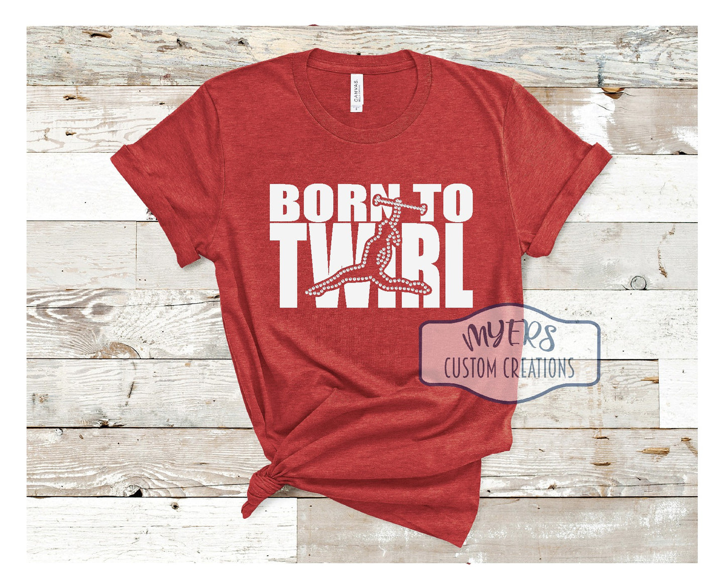 Born To Twirl heather red Bella Canvas t-shirt with white HTV and crystal rhinestones
