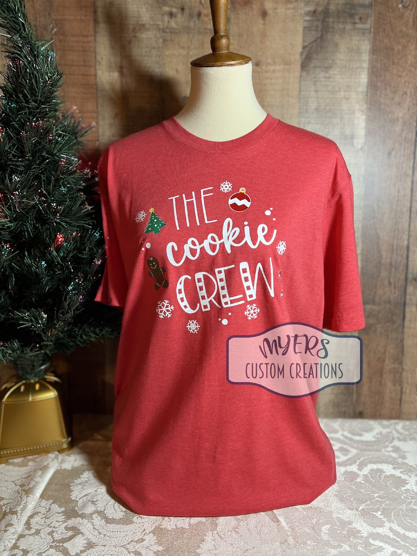 The Cookie Crew heather red Bella+Canvas t-shirt with white, red, green, chocolate, & yellow HTV