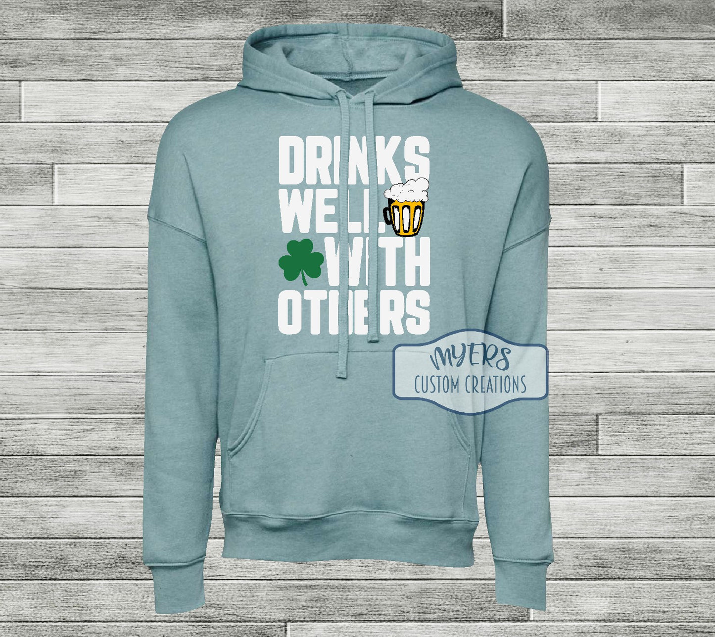 Drinks Well With Others heather blue lagoon Bella Canvas hoodie with white, black, sun, and green HTV