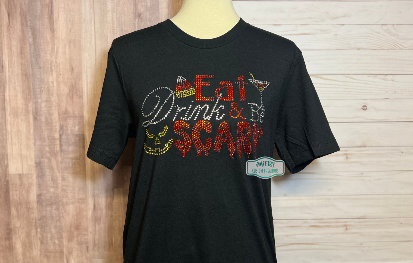 Eat Drink and Be Scary Rhinestone Shirt on Black Bella+Canvas t-shirt with crystal, orange, and citrine rhinestones