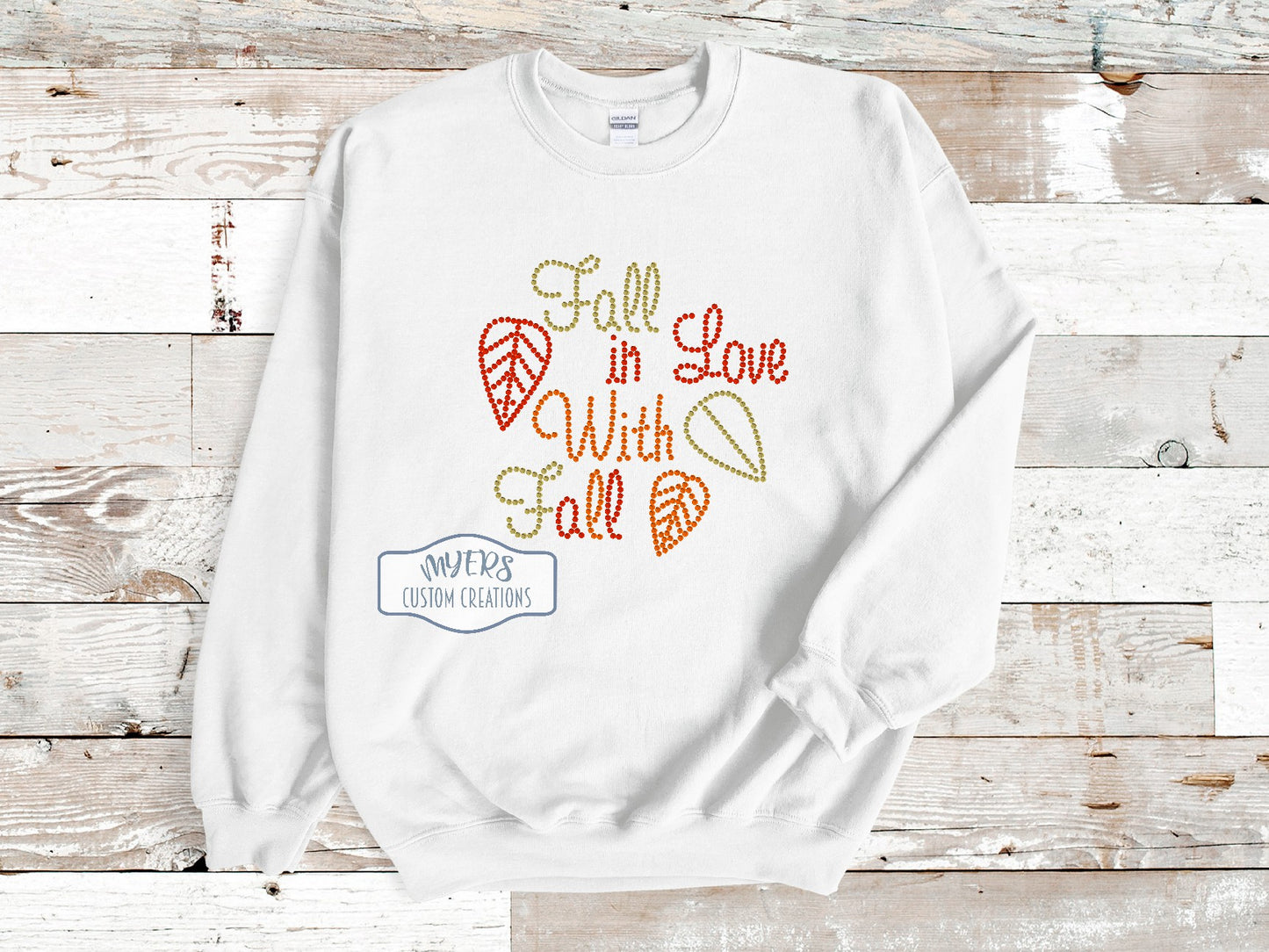 Fall in Love With Fall Rhinestone White Gildan sweatshirt with Gold, Red Siam, & Orange rhinestones.