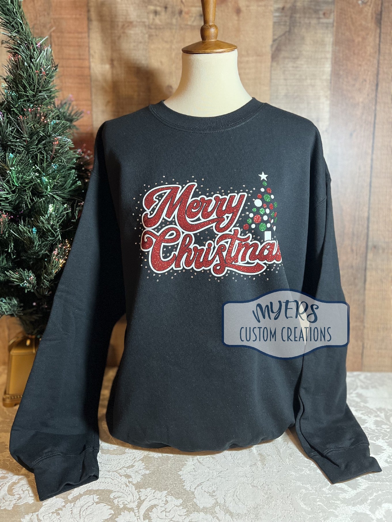 Merry Christmas Tree Rhinestone black sweatshirt with white glitter, green glitter, & red glitter HTV and crystal rhinestones