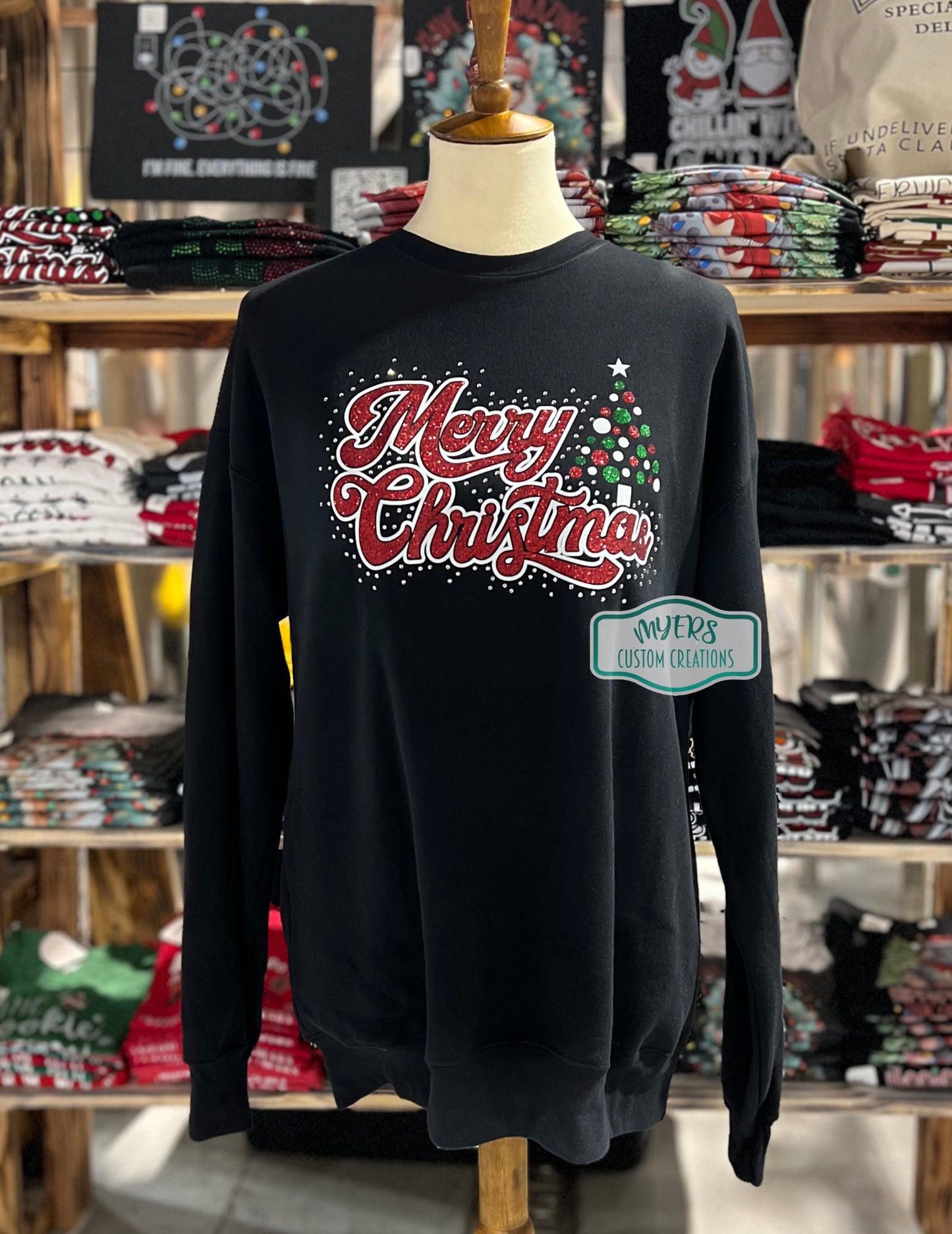 Merry Christmas Tree Rhinestone super soft black Bella+Canvas sweatshirt with white glitter, green glitter, & red glitter HTV and crystal rhinestones