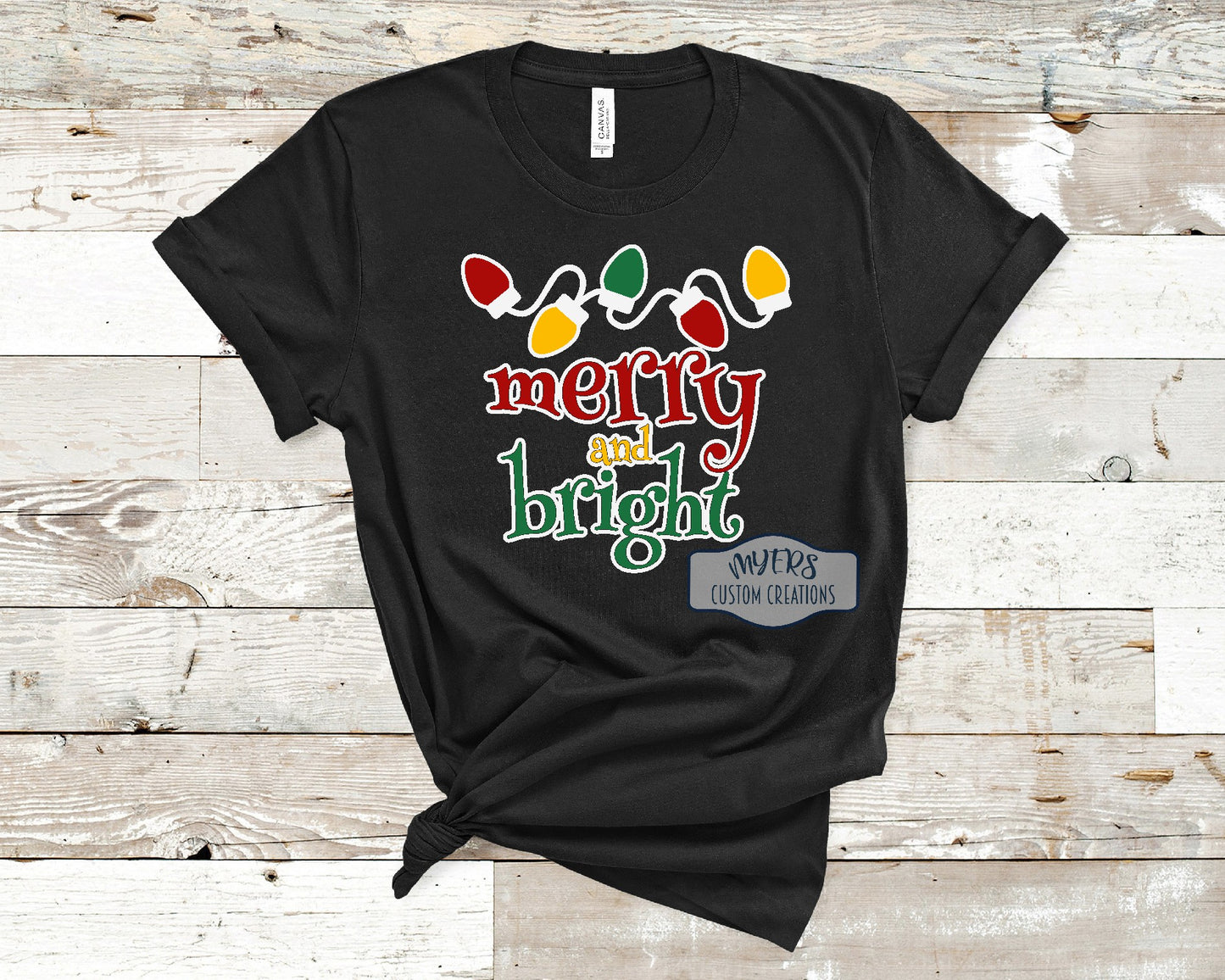 Merry & Bright Christmas Lights black t-shirt with white, red, yellow, and green HTV