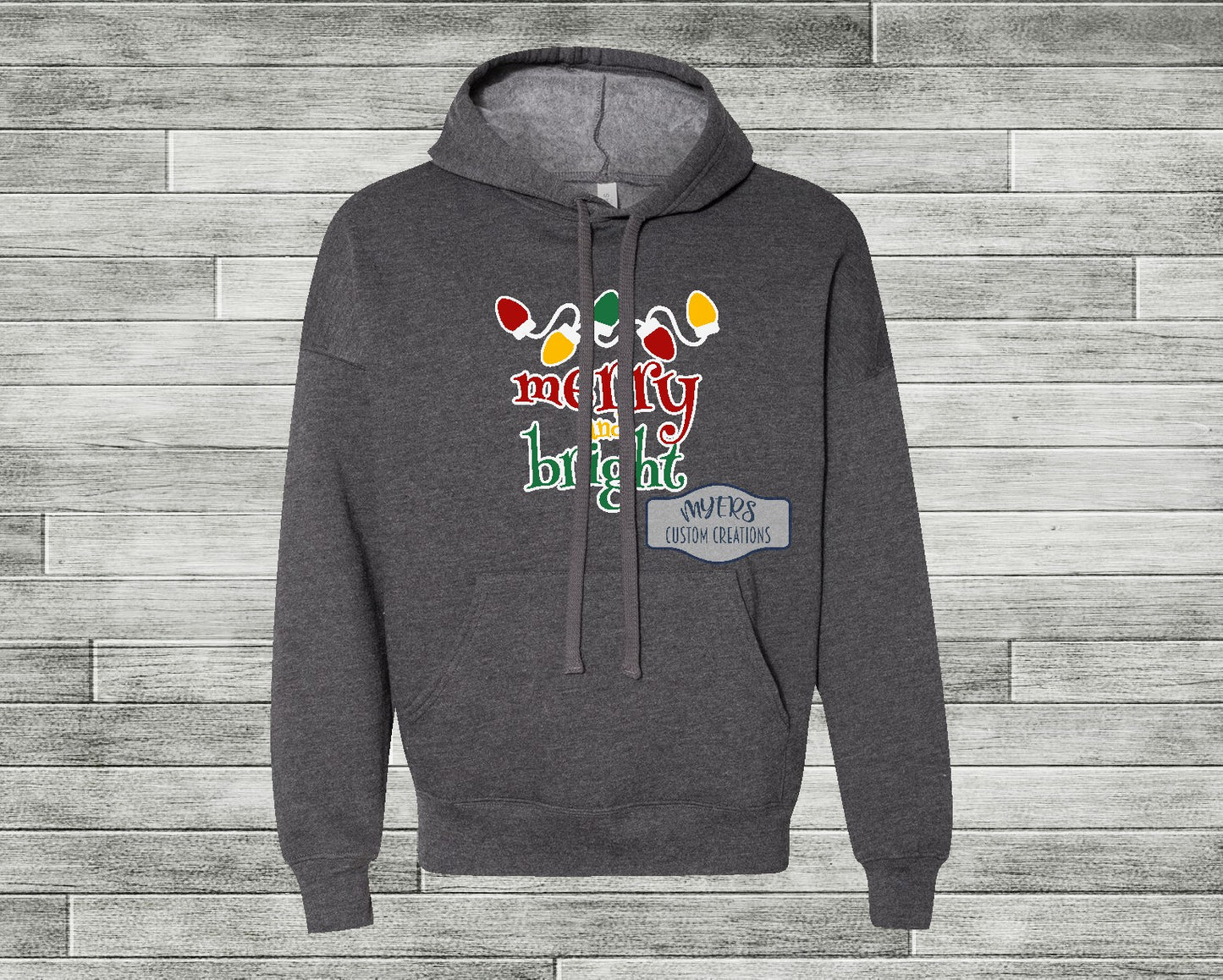 Merry & Bright Christmas Lights heather dark grey Bella+Canvas hoodie with white, red, yellow, and green HTV