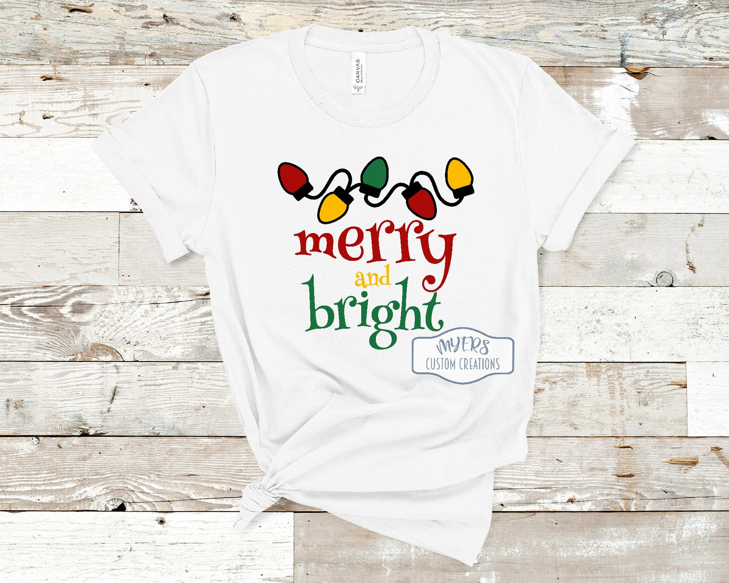 Merry & Bright Christmas Lights white t-shirt with black, red, yellow, and green HTV