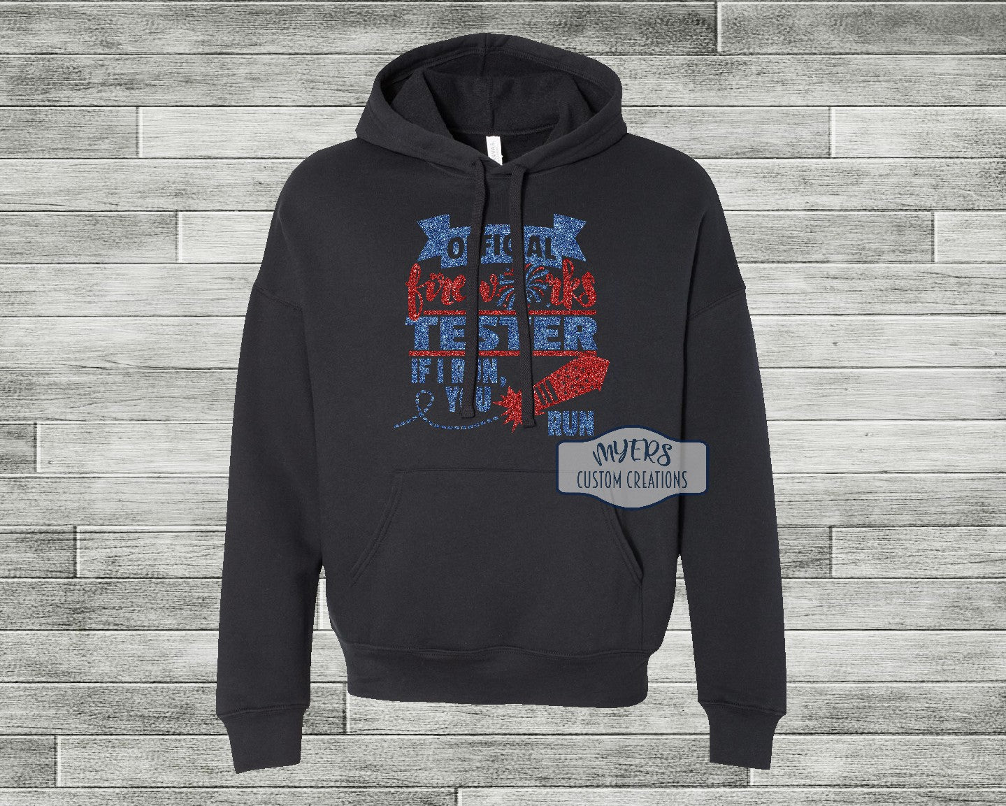 Official Fireworks Tester black Bella+Canvas hoodie with blue glitter and red glitter HTV