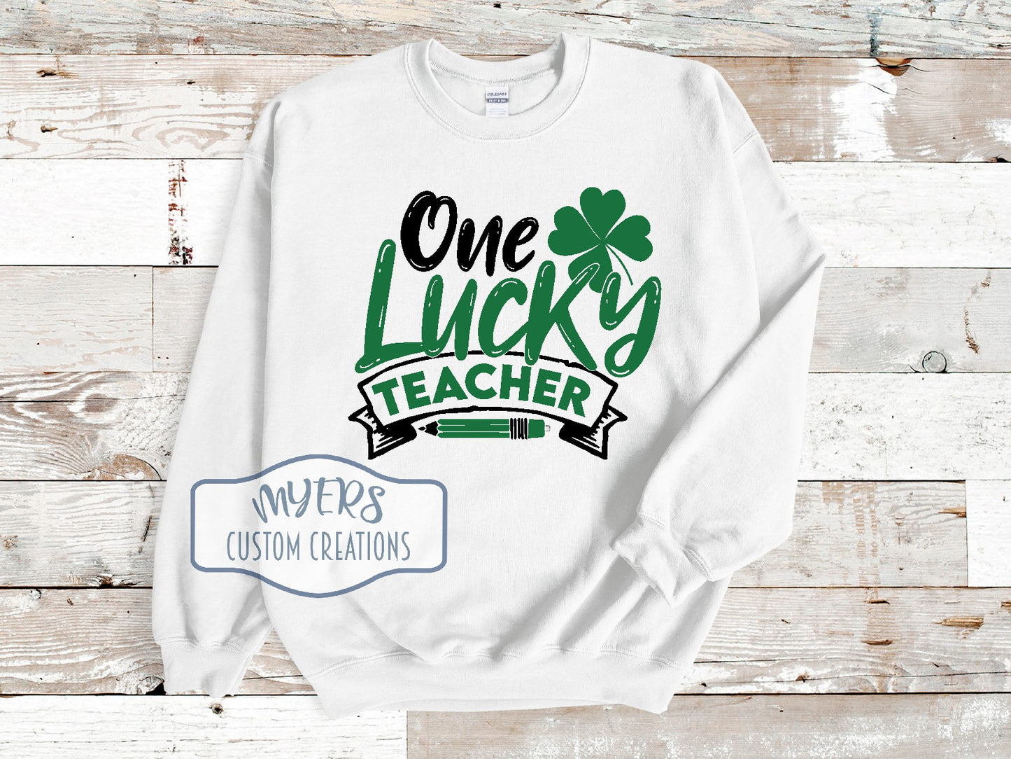 One Lucky Teacher white Gildan sweatshirt with black and green HTV