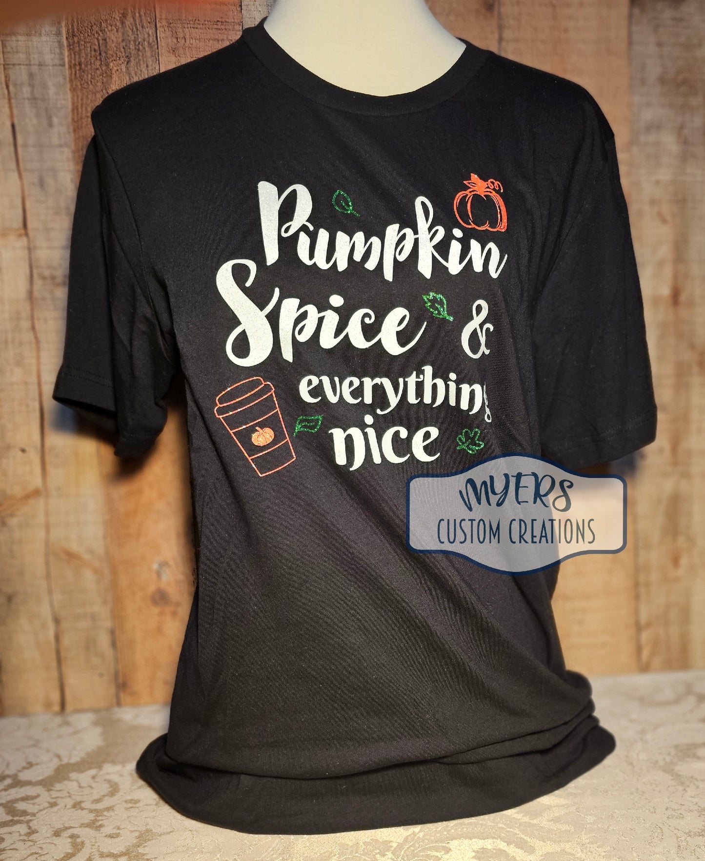 Pumpkin Spice & Everything Nice Black Bella+Canvas t-shirt with white glitter, orange glitter, and green glitter HTV