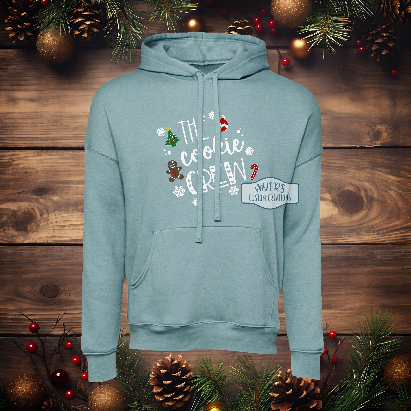 The Cookie Crew heather blue lagoon Bella+Canvas hoodie with white, green, yellow, red, & chocolate HTV