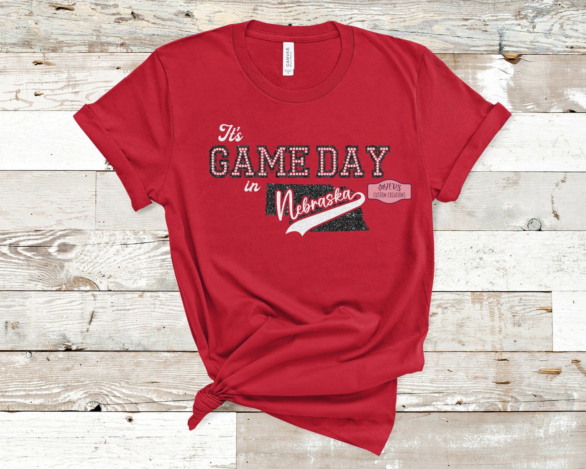 It's Game Day in Nebraska Red Bella+Canvas T-Shirt with Black Glitter, White Glitter, and Crystal Rhinestones