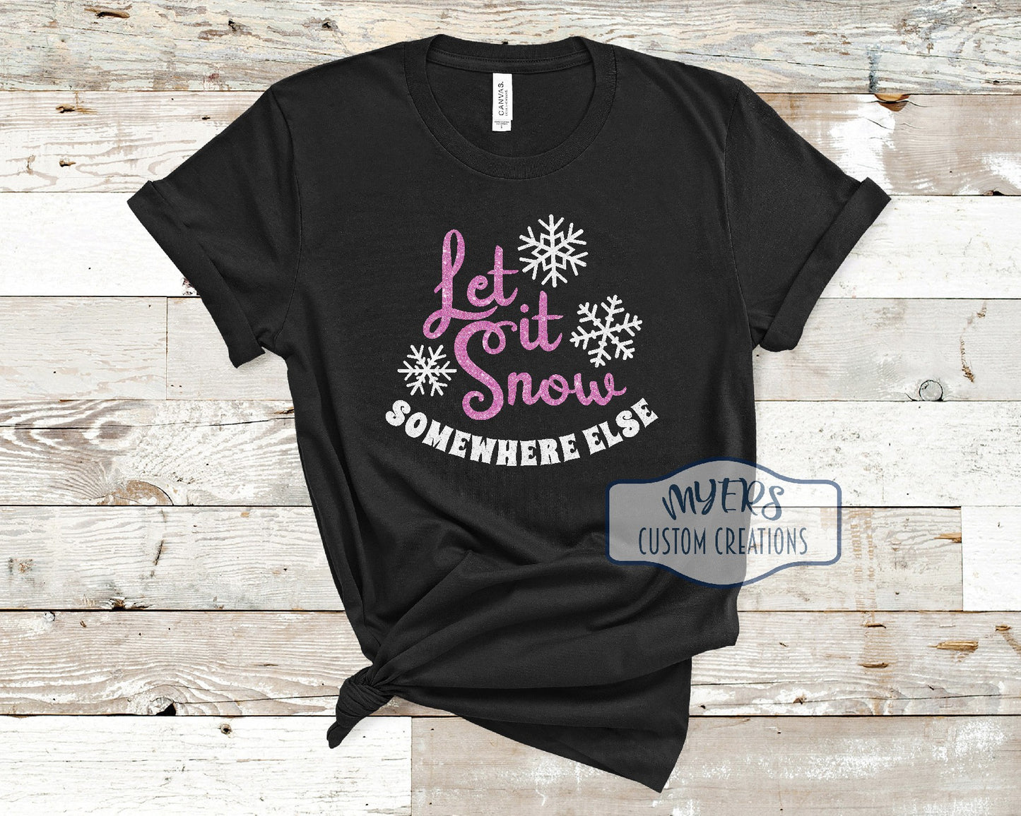 Let it Snow Somewhere Else on a black t-shirt with flamingo pink glitter and white glitter