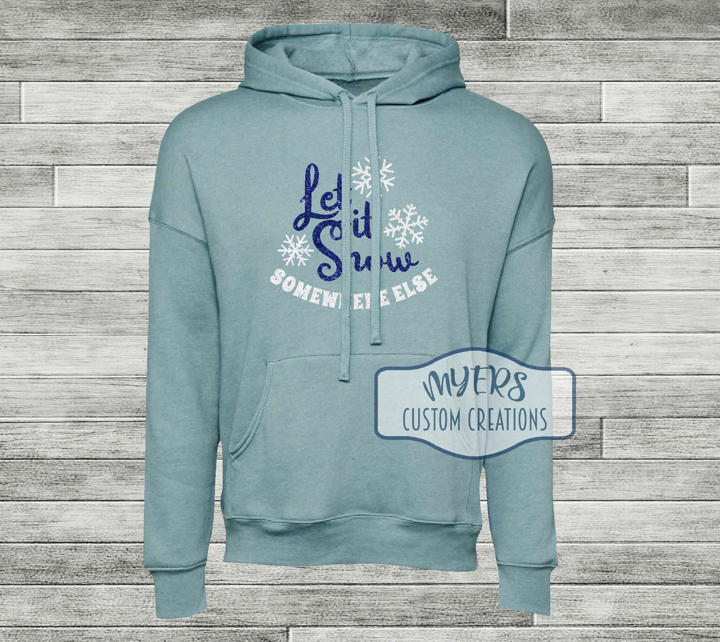 Let it Snow Somewhere Else on a heather blue lagoon Bella Canvas hoodie with royal blue glitter and white glitter