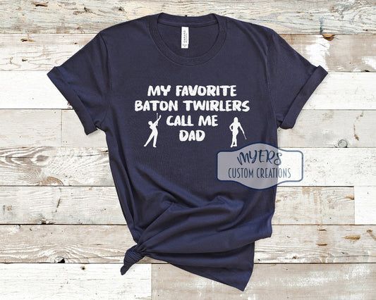 My Favorite Baton Twirlers Call Me Dad navy Bella Canvas t-shirt with male and female twirler silhouettes and White HTV