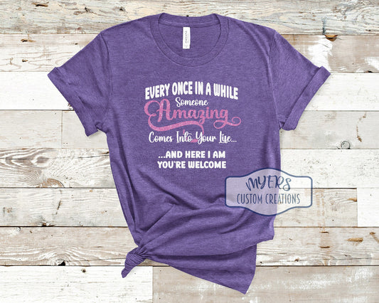 Someone Amazing heather purple Bella Canvas t-shirt with white and flamingo pink glitter HTV